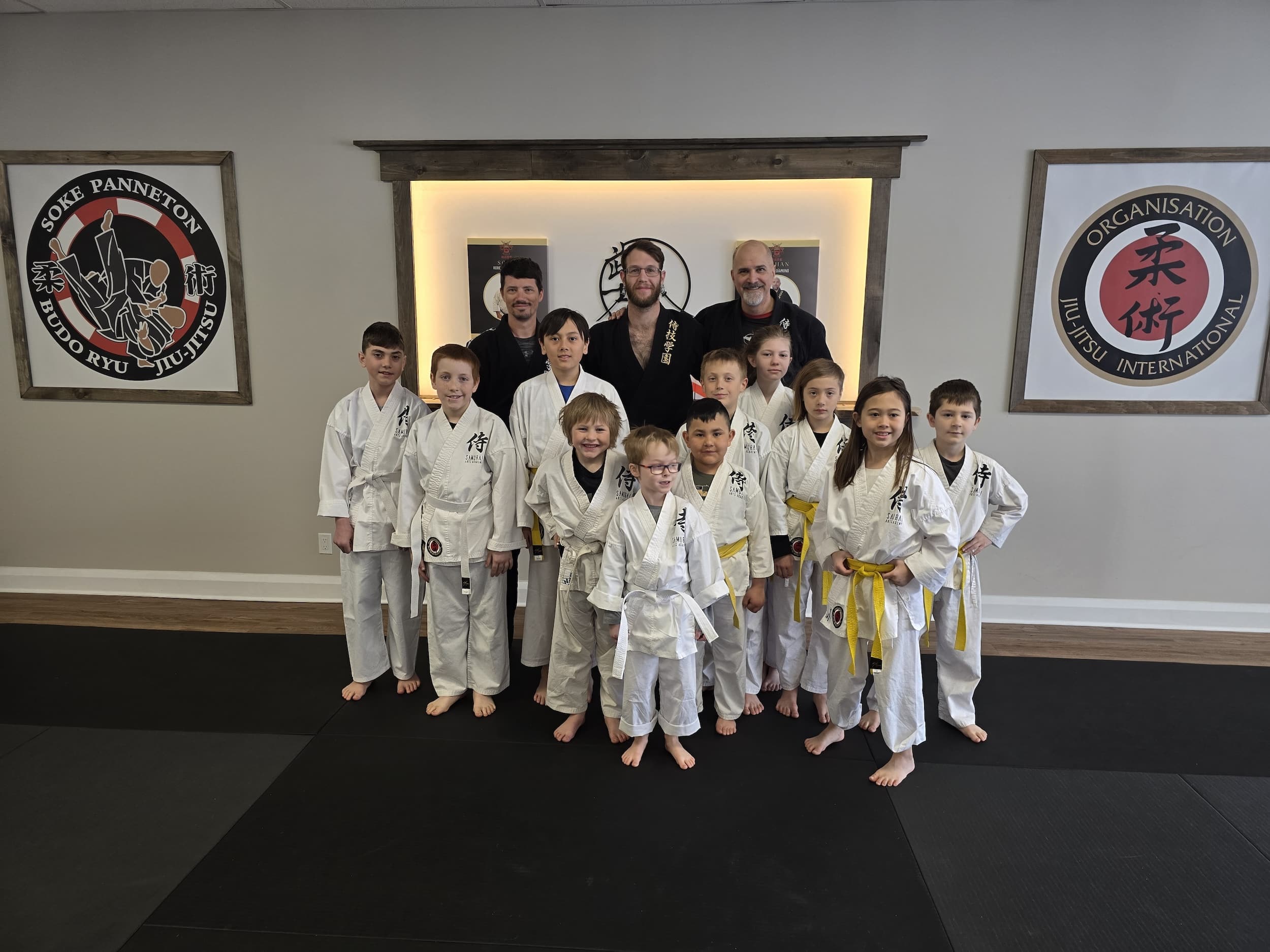 Samurai Arts Academy Chesterville young jiu-jitsu students posing with instructors